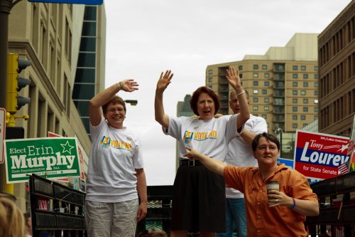 Rep. Alice Hausman and Sen. Mary Jo McGuire wave to the crowd.